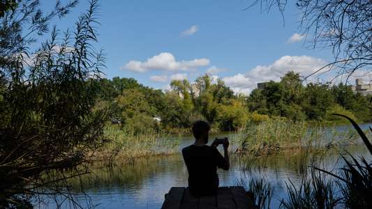 UEA student filming by the UEA broad