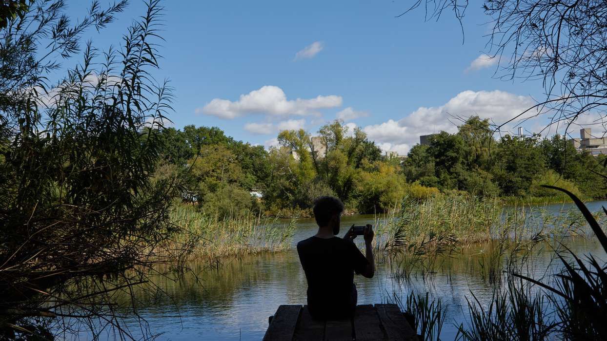 UEA student filming by the UEA broad