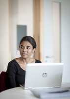 Female translator in front of a computer