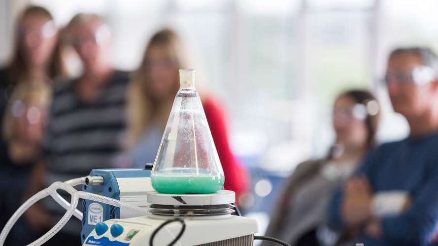 Students and Parents attending a science demonstration