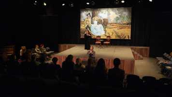 UEA drama students performing on stage to an audience