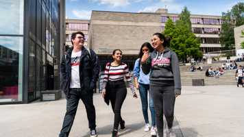 Students walking at the Square on UEA campus