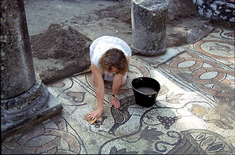 Archaeologist doing a condition survey of Baptistery mosaic
