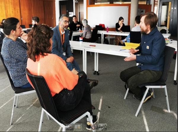 People discussing at a table