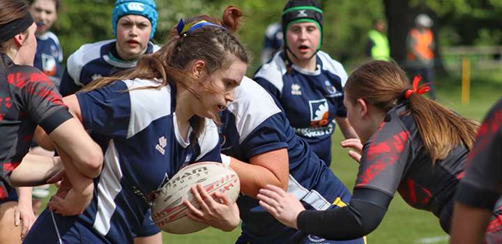 A group of women playing rugby
