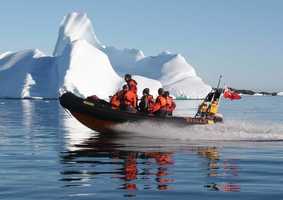 Environmental Sciences Research Boat Near Iceberg