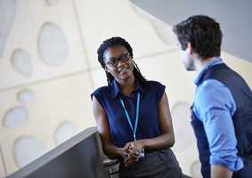 Two postgraduate researchers having a conversation