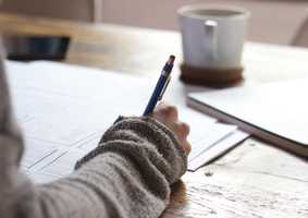 Woman writing at a desk