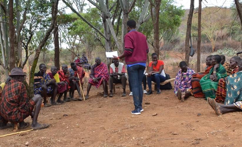 Staff from Karamoja Development Forum meeting with Tepeth Community