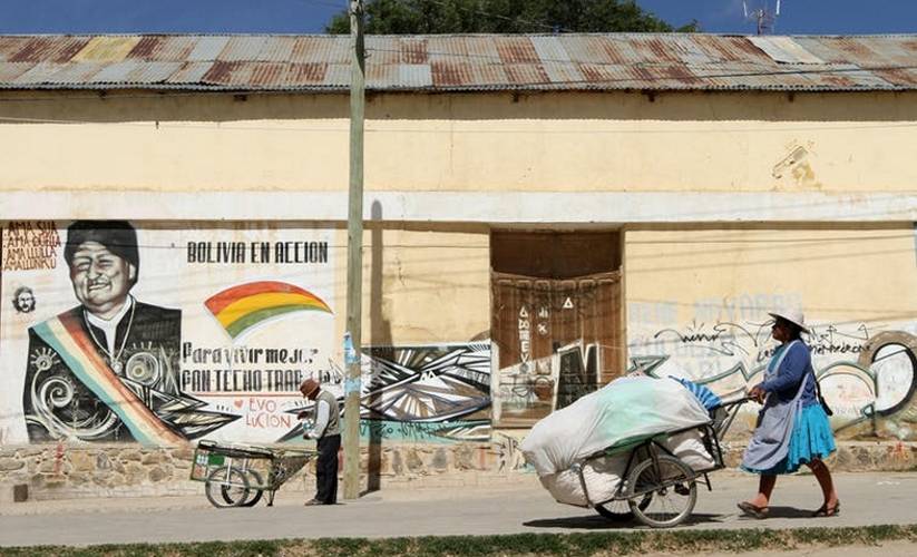 Indigenous Woman pushing a cart in Bolivia